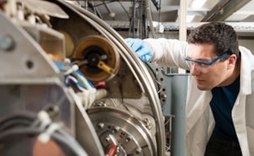 Martin Sterniczuk in lab working with metal machinery